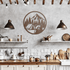 Bear camping metal wall art displayed in a modern kitchen with rustic decor, showcasing outdoor adventure theme.