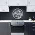 Metal wall art featuring a bear, mountain, and camping scene in a modern kitchen setting