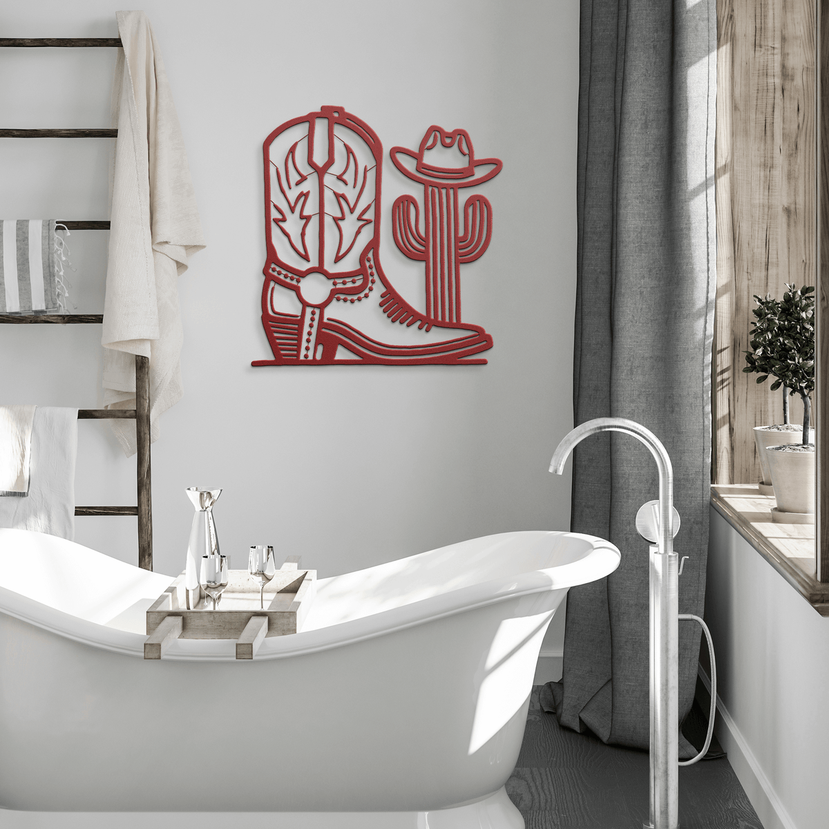 Red metal cowboy boot and cactus wall art in modern bathroom with bathtub and natural light