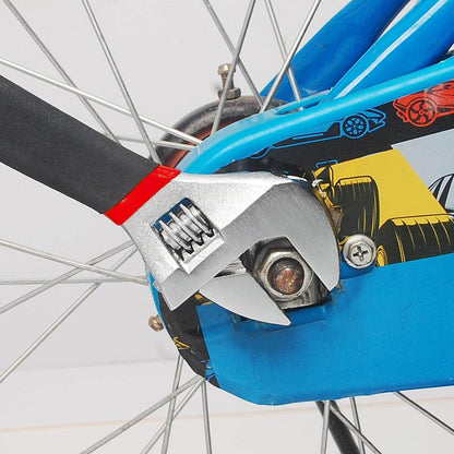 Adjustable wrench from 71 piece household tool kit tightening bolt on bicycle wheel