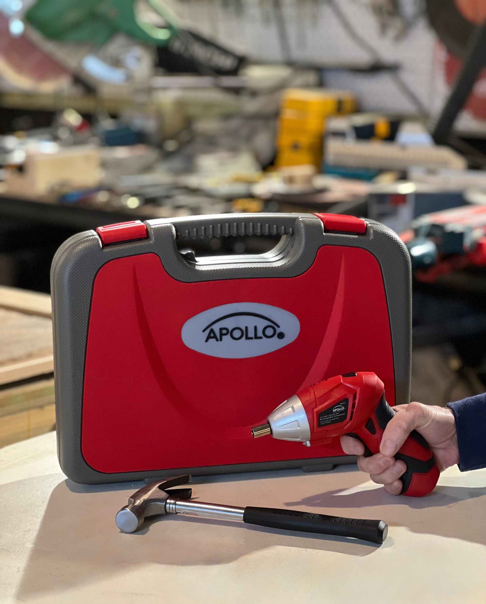 Apollo 135 piece household tool set with cordless screwdriver, hammer, and red carrying case for DIY repairs and maintenance