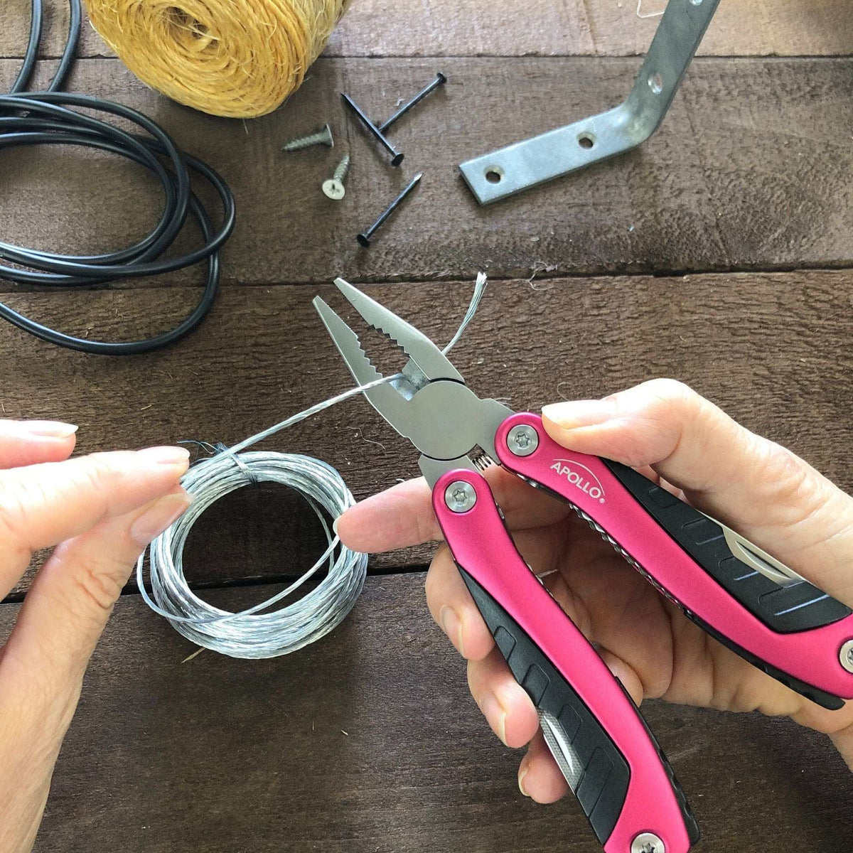 14-in-1 pink pocket multitool with pliers, screwdrivers, knife, can opener for outdoor camping and fishing