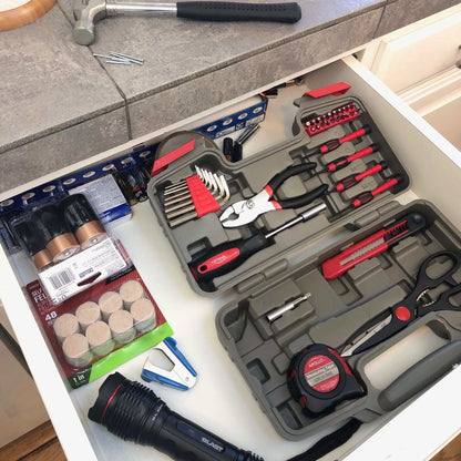 39 piece general tool set in compact storage case with pliers, hammer, tape measure, scissors, and screwdrivers in kitchen drawer
