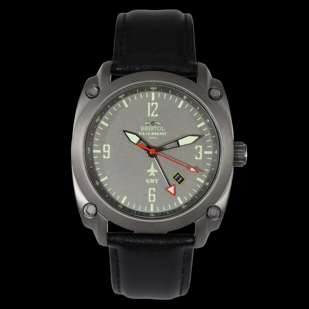 F-18 Hornet tribute watch with gunmetal case, gray dial, black leather strap, and GMT function