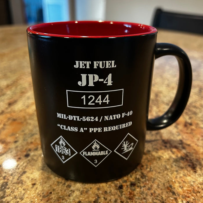 JP-4 Jet Fuel Coffee Mug shaped like a vintage fuel drum with hazard markings and red interior.