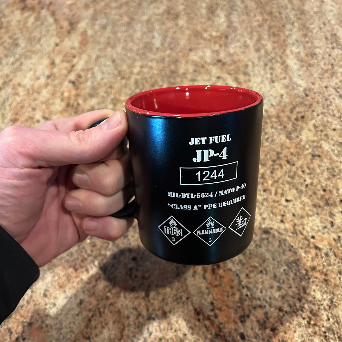 JP-4 Jet Fuel Coffee Mug designed like a vintage fuel drum with hazard markings and red interior