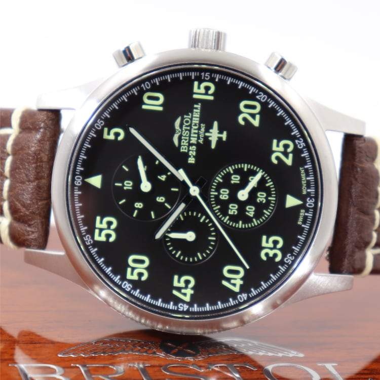 B-25 Mitchell tribute watch with stainless steel brushed case, black dial, and brown leather stitched band