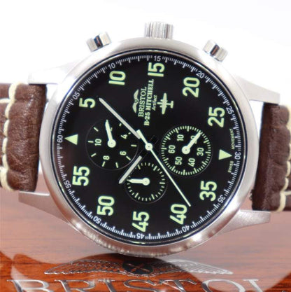 B-25 Mitchell tribute watch with stainless steel brushed case, black dial, and brown leather stitched band