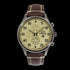 B-25 Mitchell tribute watch with polished stainless steel case, beige dial, and brown leather strap