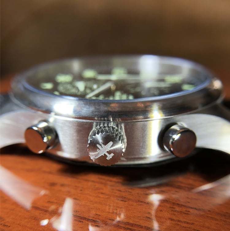 B-25 Mitchell tribute watch with stainless steel brushed finish, black dial, and brown leather stitched band