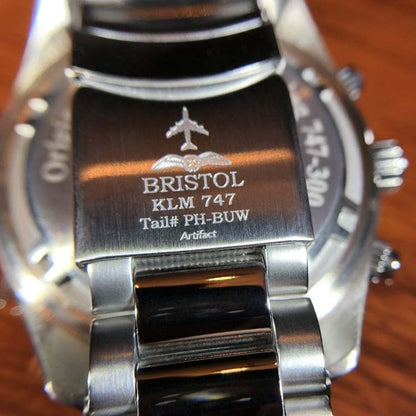 747 Tribute stainless steel watch with white dial and KLM 747 airframe artifact