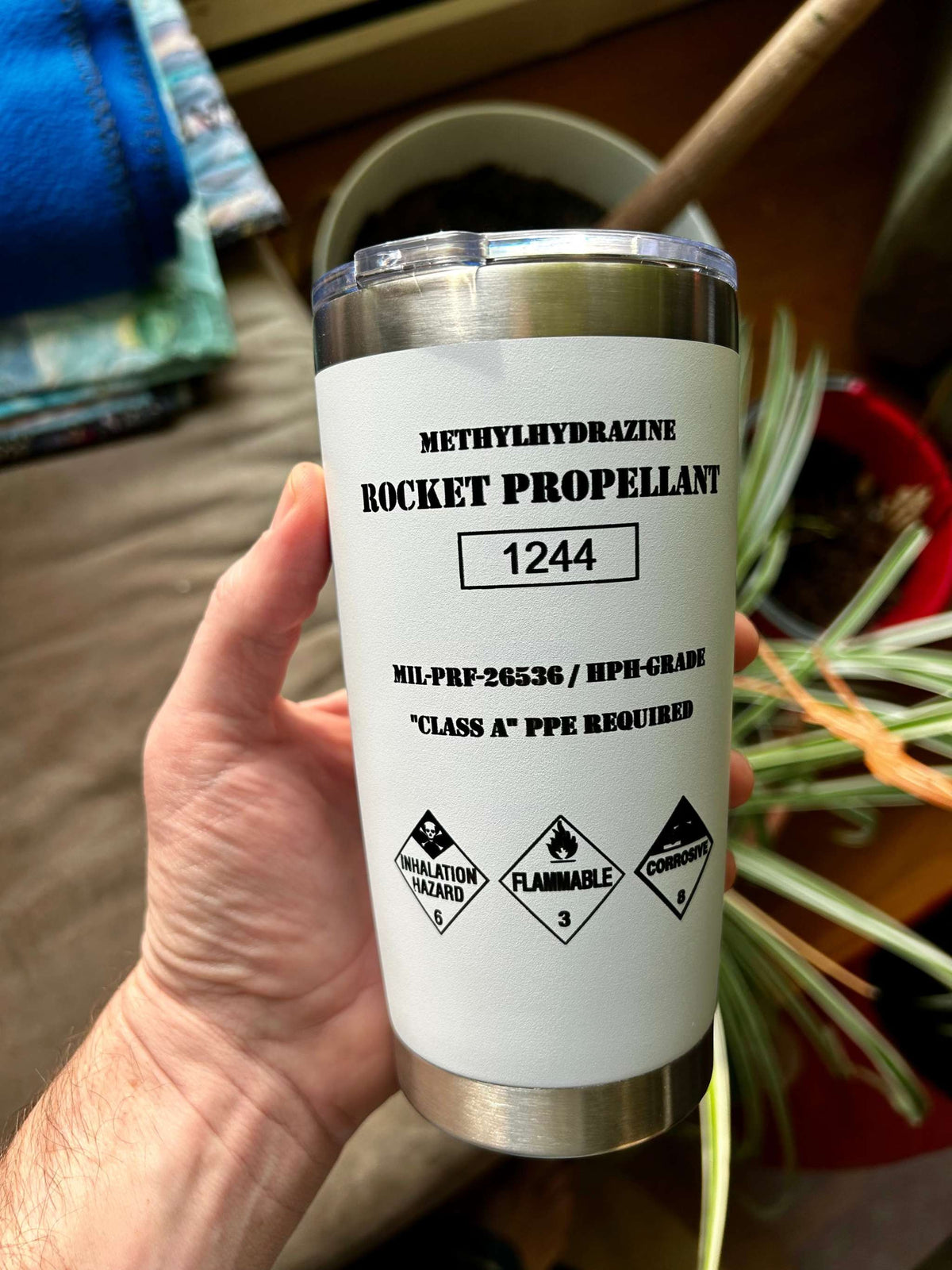 White stainless steel Rocket Propellant Tumbler with hydrazine hazard markings and Red Planet Resorts logo, double-insulated and durable design