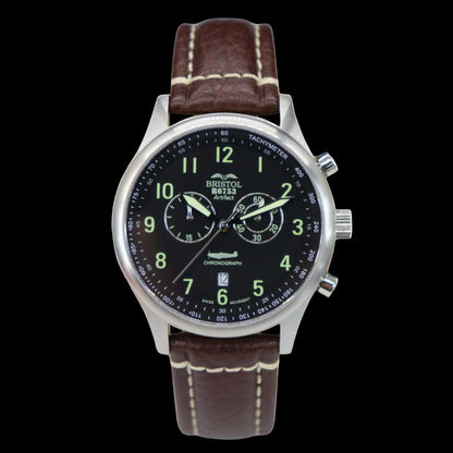 Wristwatch with brown leather strap and black dial on a white background