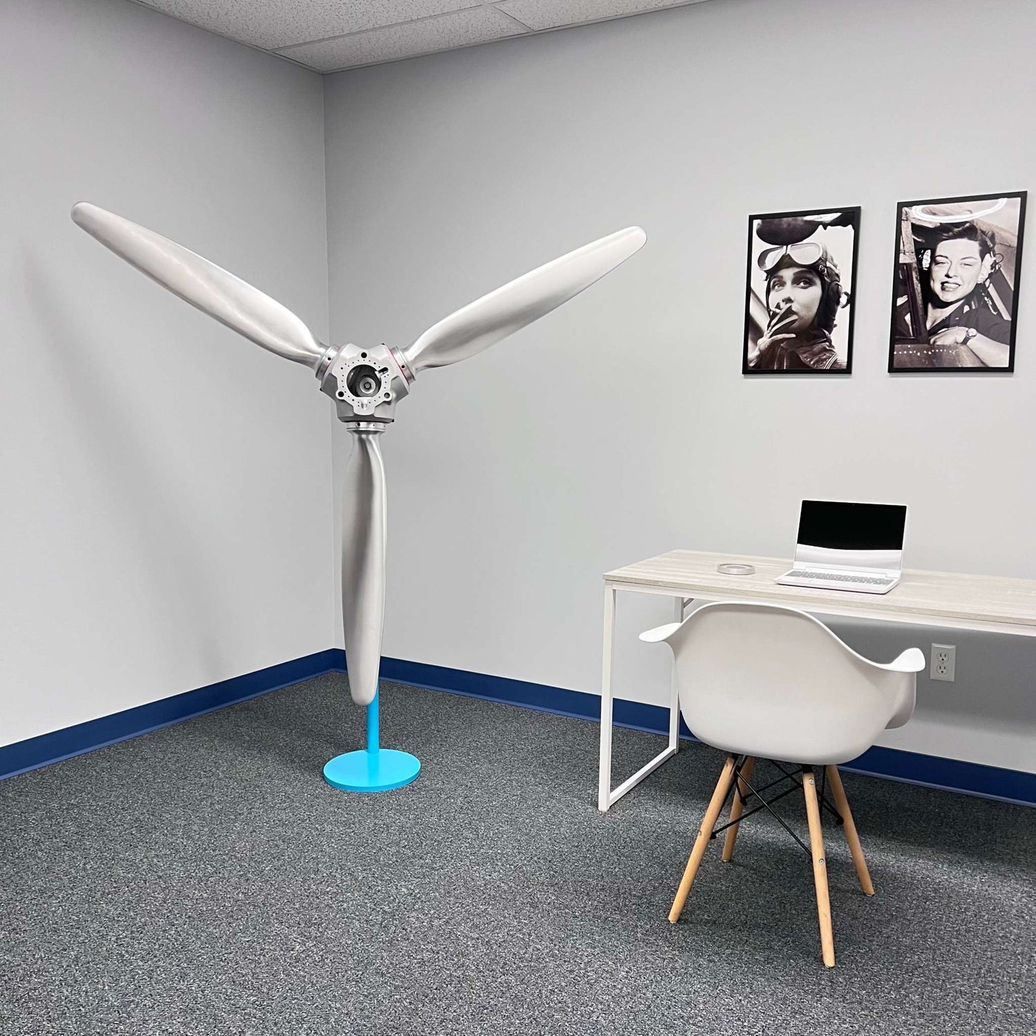 3-bladed McCauley aluminum airplane propeller with brushed finish and red snap rings wall display