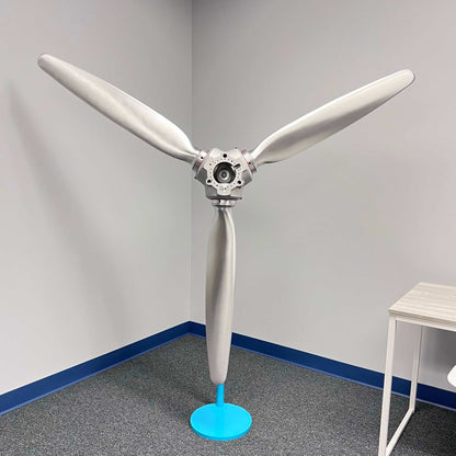 3-bladed McCauley aluminum airplane propeller with brushed finish and red snap rings wall display