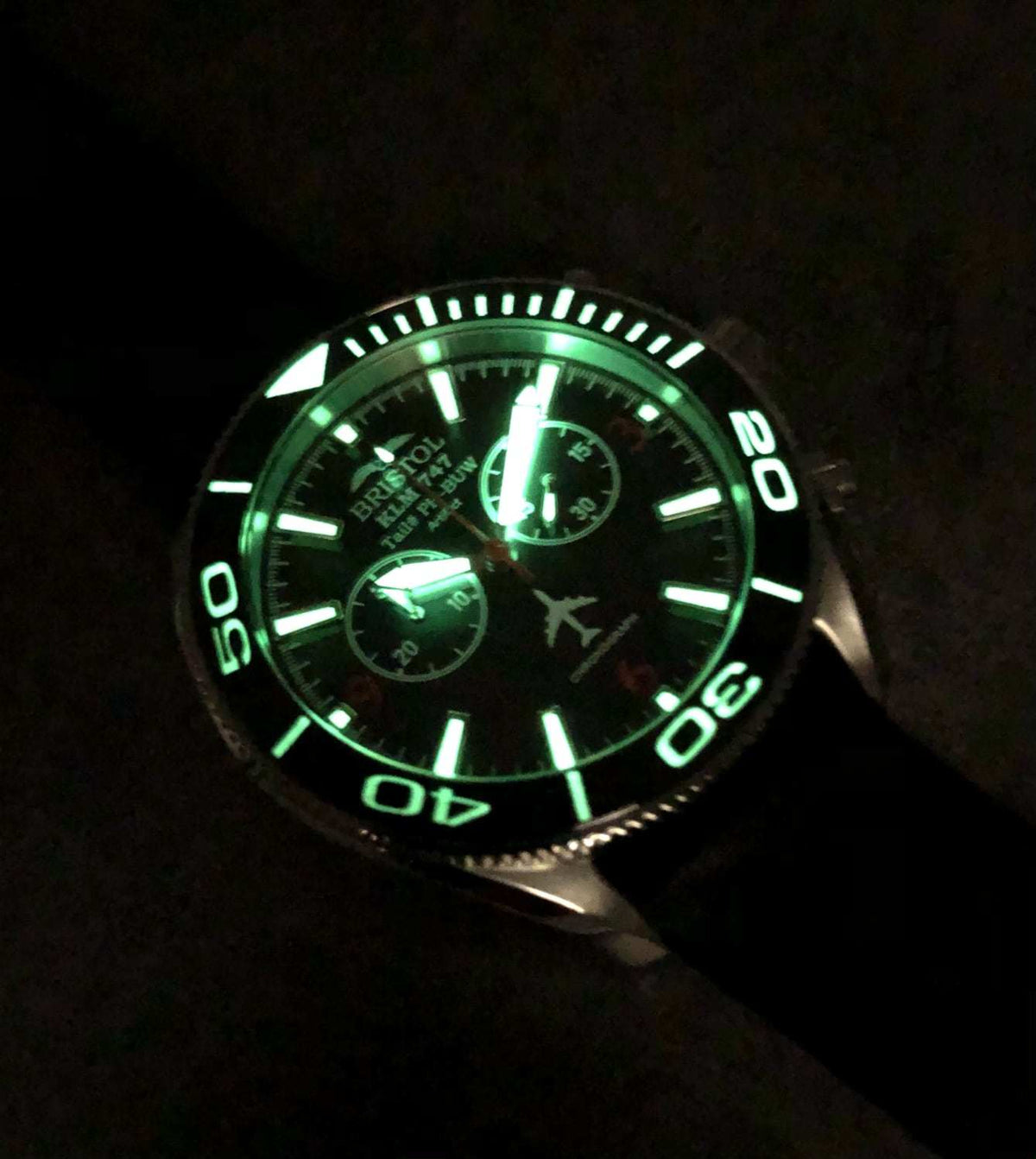 747 Tribute stainless steel watch with white dial and KLM 747 airframe artifact
