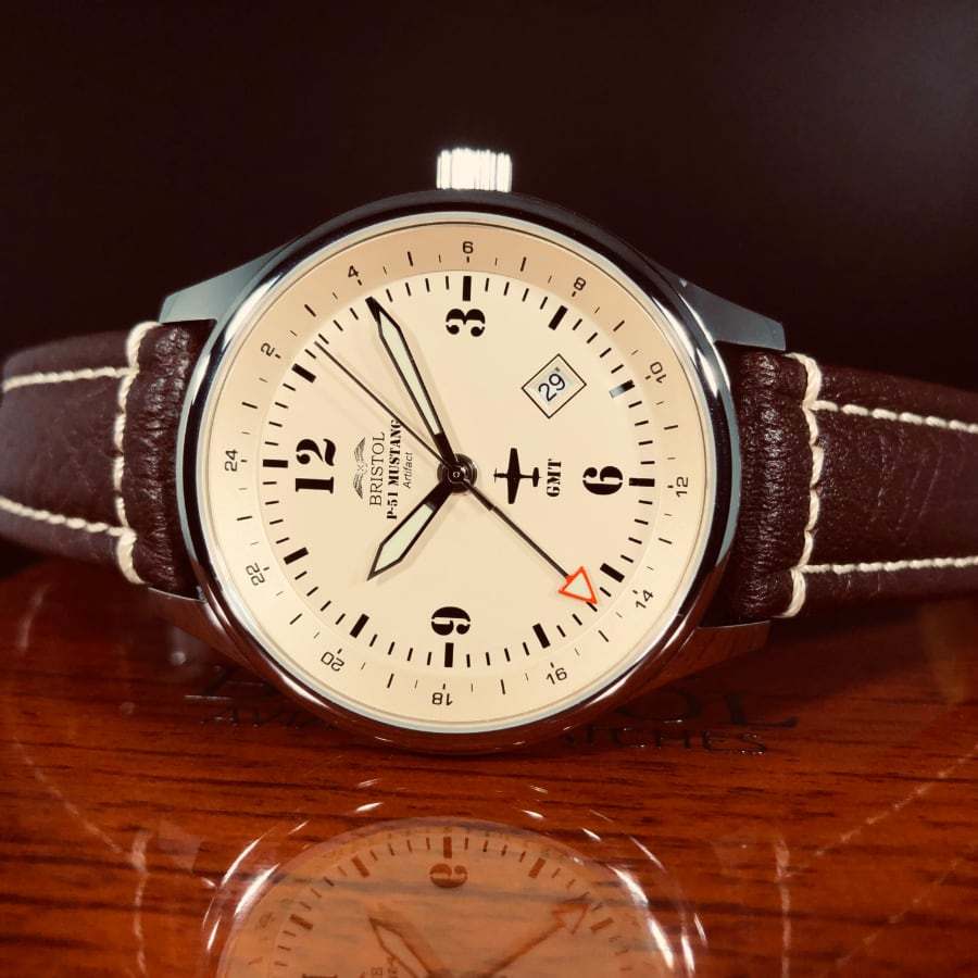 P-51 Mustang Tribute watch with beige dial, polished stainless steel case, and brown leather strap
