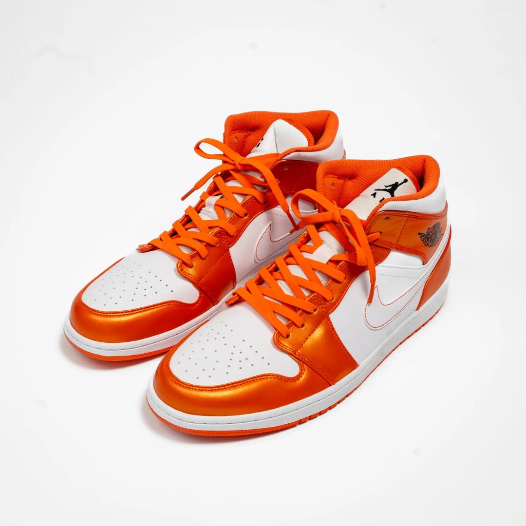 Close-up of coral orange Bread Laces, stretchy shoelaces that stay secure with one tie