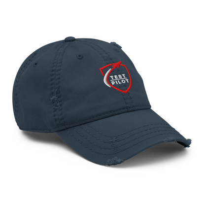 Test Pilot Aviation Hat in navy blue with distressed brim and embroidered logo, perfect for stylish outfits.