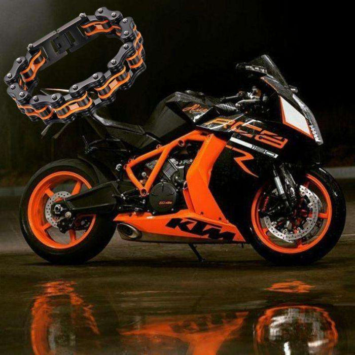 Colorful motorcycle chain bracelet displayed above a black and orange KTM motorcycle, emphasizing motorcycle culture.