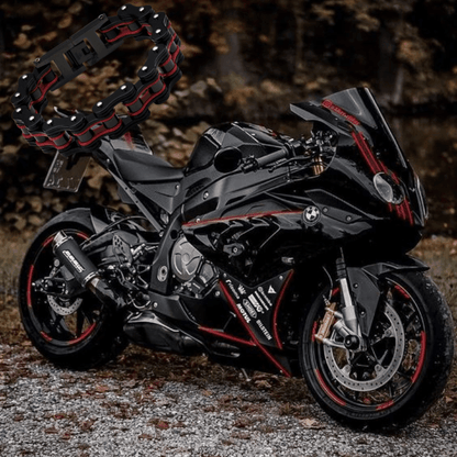 Colorful motorcycle chain bracelet displayed over a sleek black motorcycle, showcasing unique design and motorcycle culture.