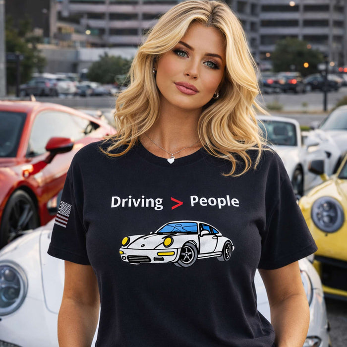 Black unisex Driving Is Better Than People T-Shirt with white printed text, soft cotton material, perfect for car lovers and introverts.