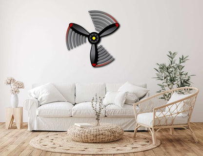 Multicolor metal sign propeller wall art in modern living room with white sofa and natural decor