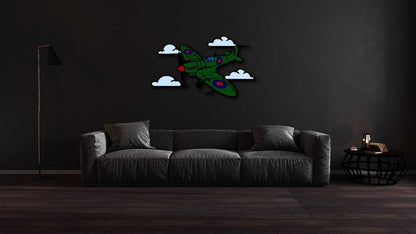 Multicolor metal sign of a green Spitfire plane with clouds on dark living room wall