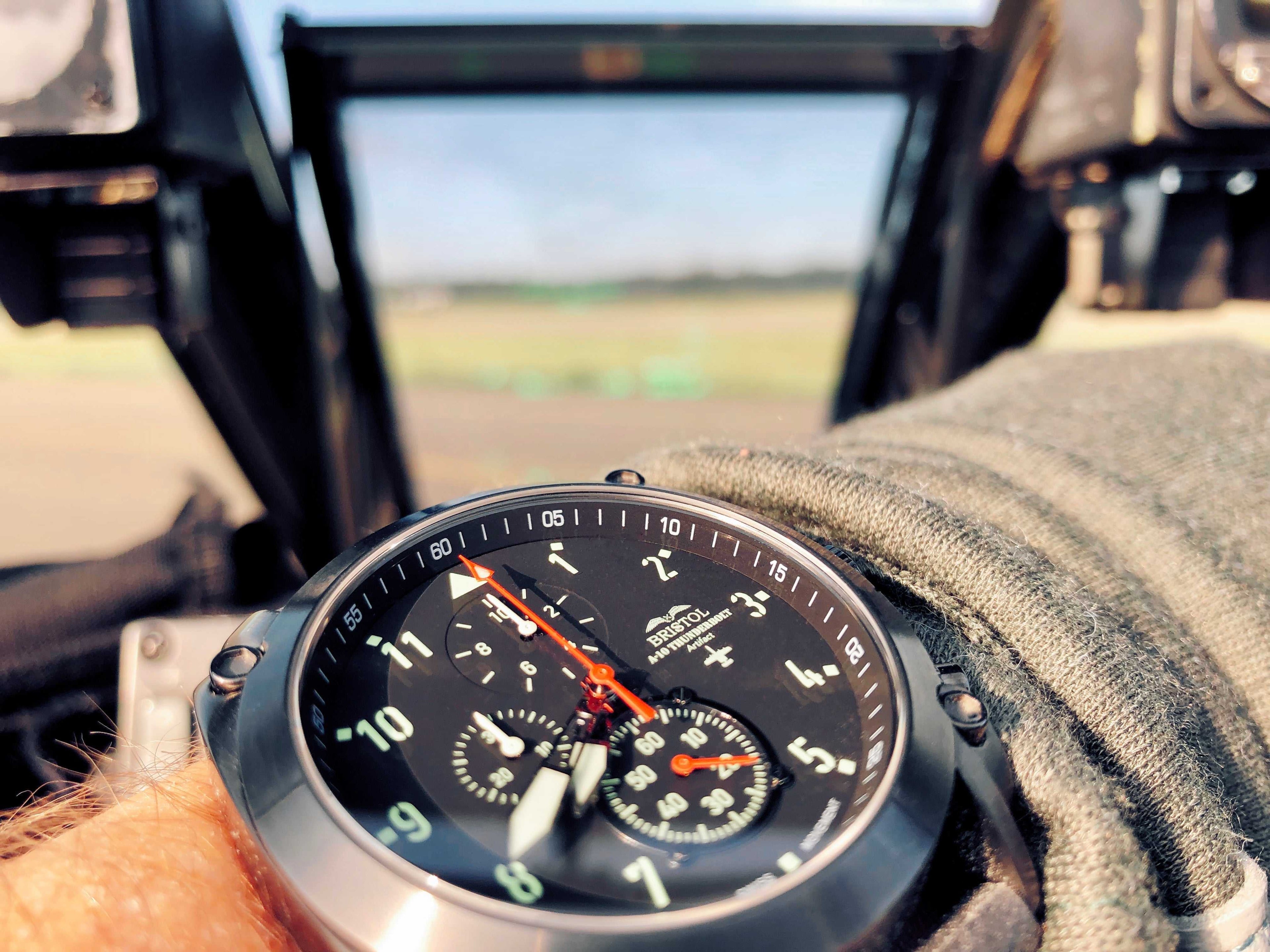 Close-up of A-10 Thunderbolt tribute watch with gunmetal finish and black leather band on wrist