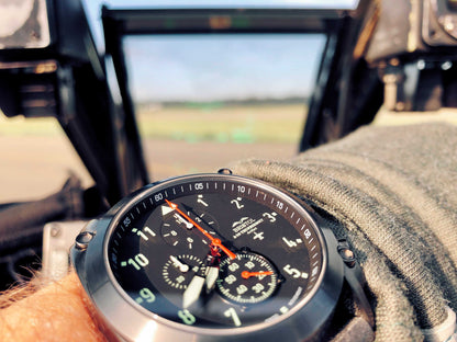 Close-up of A-10 Thunderbolt tribute watch with gunmetal finish and black leather band on wrist