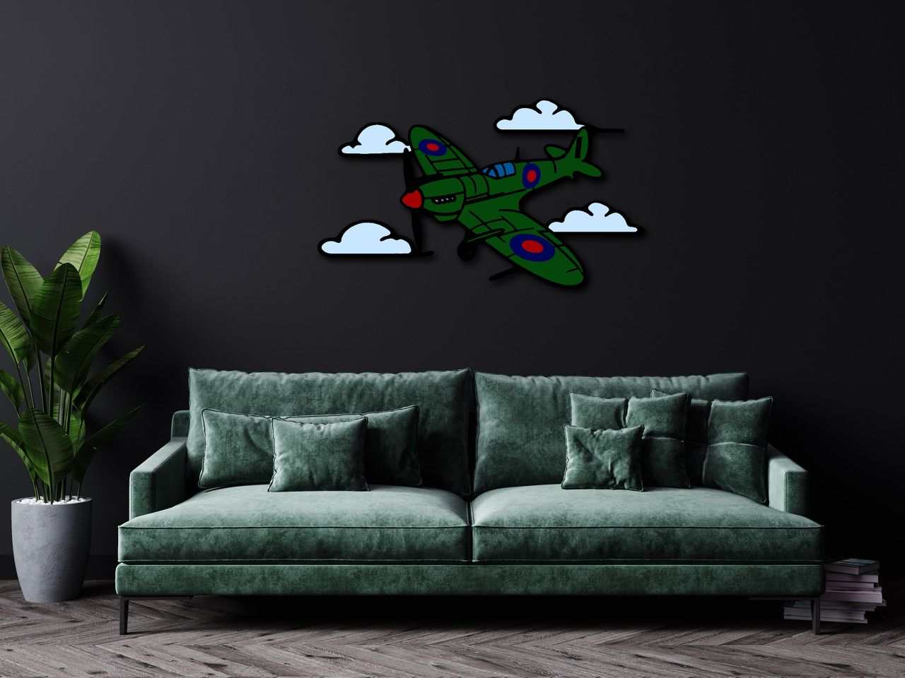 Multicolor metal sign featuring a green Spitfire airplane and clouds mounted on a dark wall above a green velvet sofa