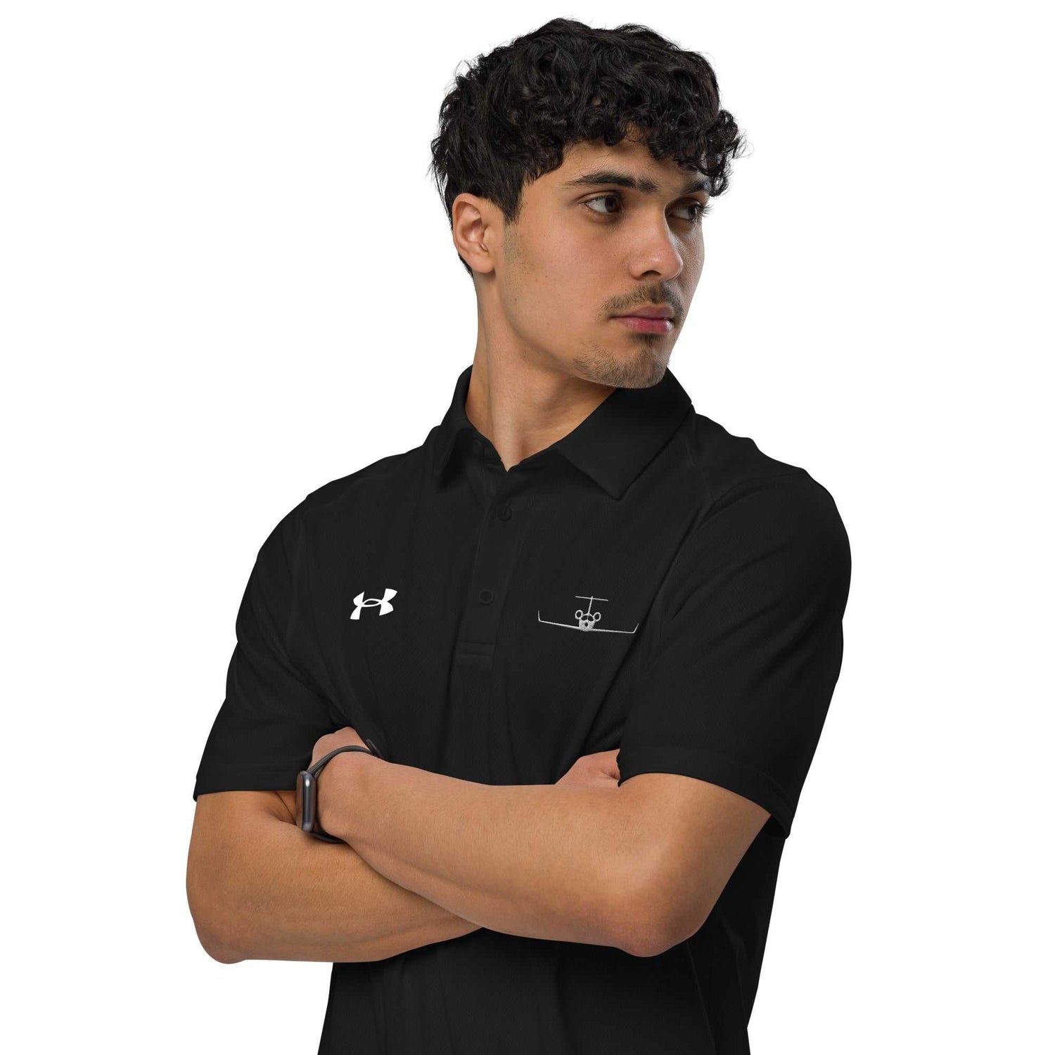 Man wearing black pilot polo shirt with embroidered private jet logo and Under Armour logo