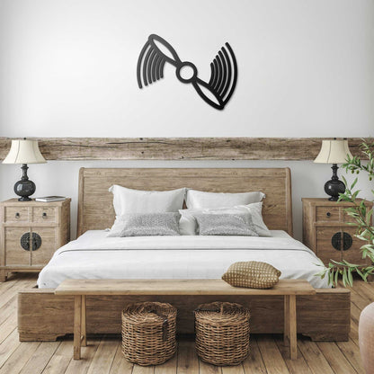 black metal propeller metal wall art aviation decor above bedroom bed