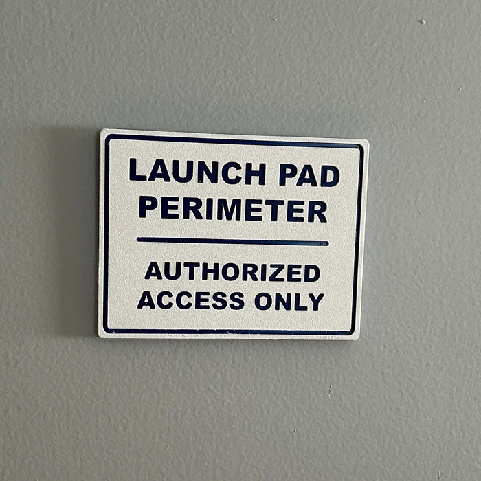 Launch Pad Perimeter high-impact wall sign with bold lettering for garages and workshops
