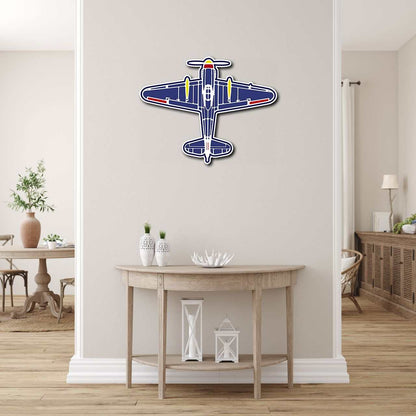 Colorful classic airplane aviation wall art in metal mounted on neutral wall above wooden console table in modern room