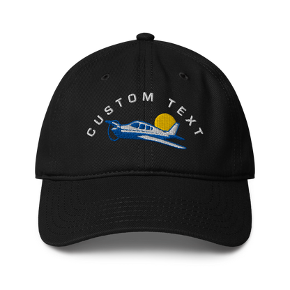 Black cap with airplane and sun design and &