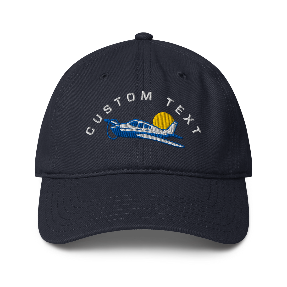 Navy blue cap with airplane and sun design on a white background
