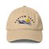 Beige cap with airplane and sun design on a white background