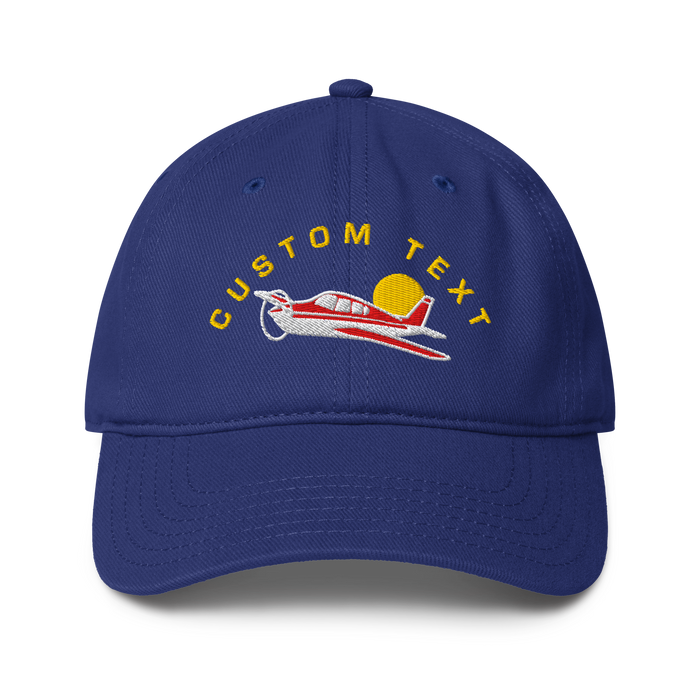 Blue cap with airplane design and 'CUSTOM TEXT' text on a white background