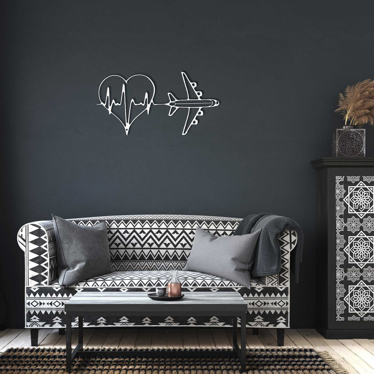 Minimalist metal wall art featuring heartbeat line and airplane for modern travel-themed decor