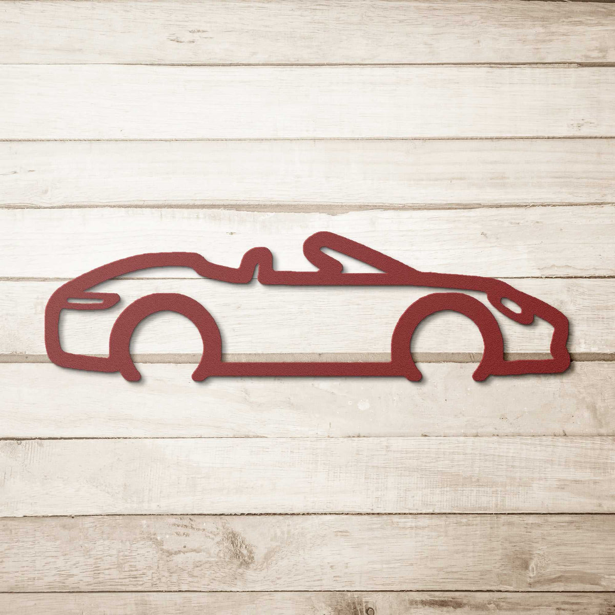 Automotive metal wall art featuring a convertible car silhouette in powder-coated steel for car lovers.