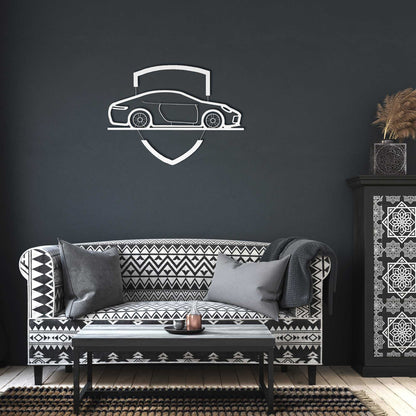 Elegant metal sign with car emblem mounted on dark wall above patterned sofa in modern living room