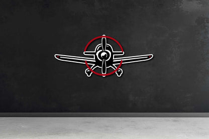 Multicolor metal sign shaped like a propeller airplane mounted on a dark wall