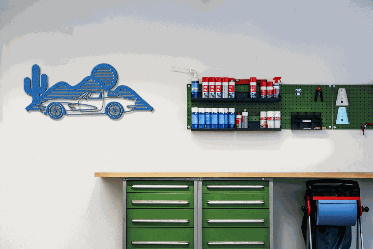 Laser-cut Corvette silhouette wall art in powder-coated steel, customizable sizes and colors, ideal for garages and gifts