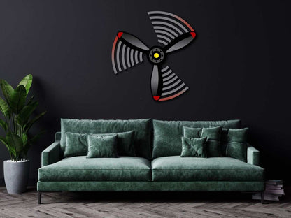 Multicolor metal sign propeller spin wall art above green sofa in modern living room