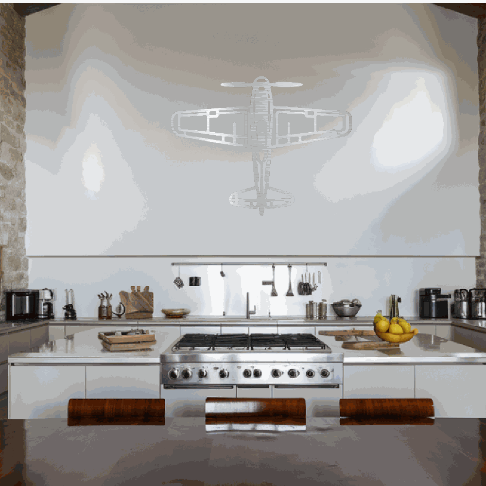Retro airplane metal art wall decoration in modern kitchen with stainless steel appliances