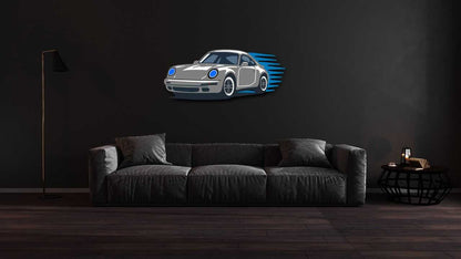 Garage wall decor steel art of a performance coupe car silhouette in multicolor heavy-duty steel mounted above a dark gray sofa