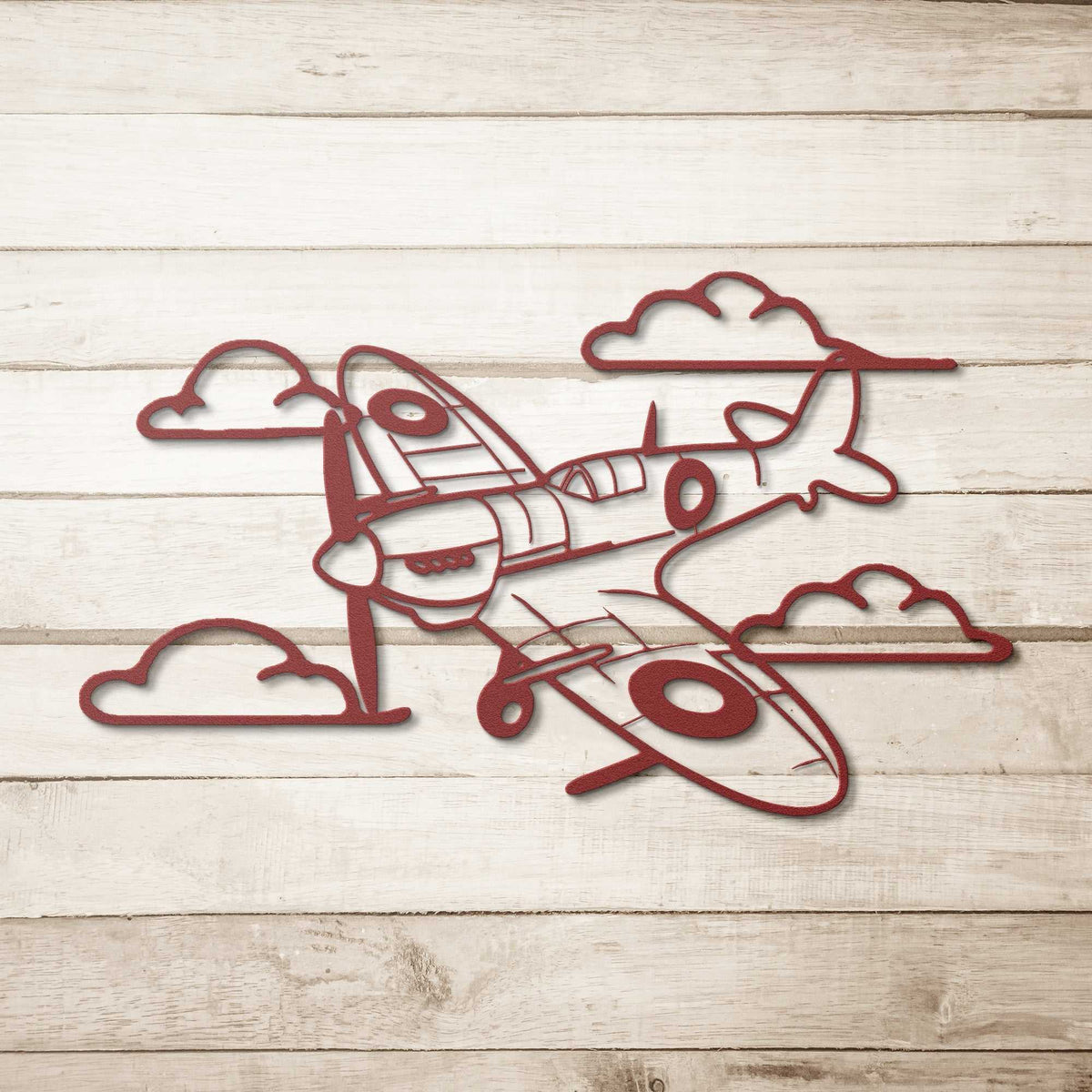 Spitfire Metal Wall Art made of 18 gauge steel, powder coated, shown against a cloudy sky background
