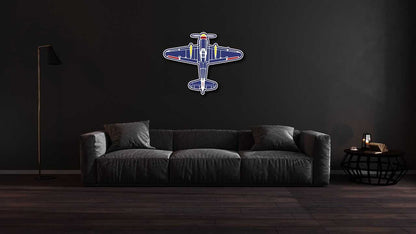 Multicolor classic plane aviation wall art metal sign mounted above dark gray sofa in modern living room