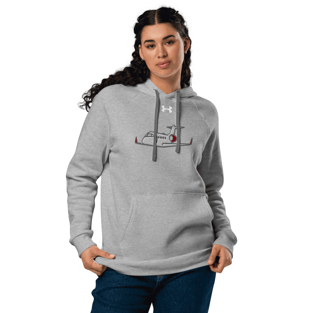 Jet Set Under Armour hoodie in grey with plane graphic, front pouch pocket, and relaxed fit on woman model